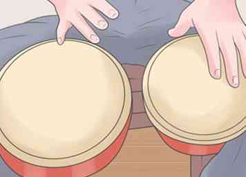 Comment jouer les Bongos (avec des photos)