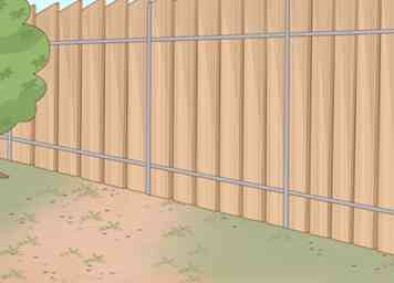 Cómo instalar cercas de alambre para perros (con fotos)